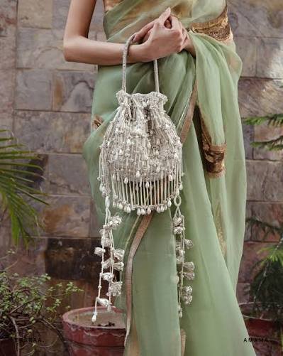 how to style potli bag with silk saree